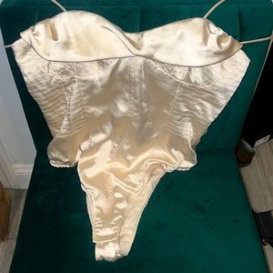 Cream colored polyester bodysuit